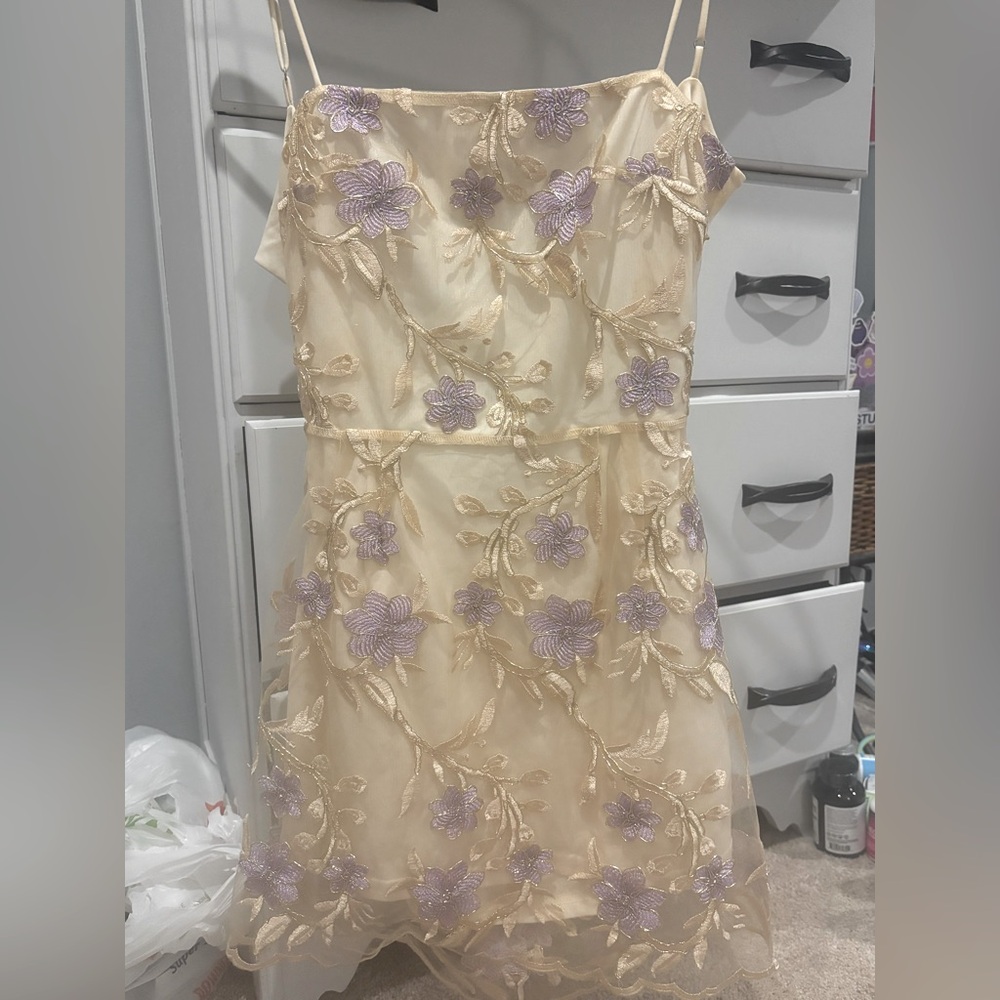 Lucy in the Sky purple and gold mini dress with flowers.